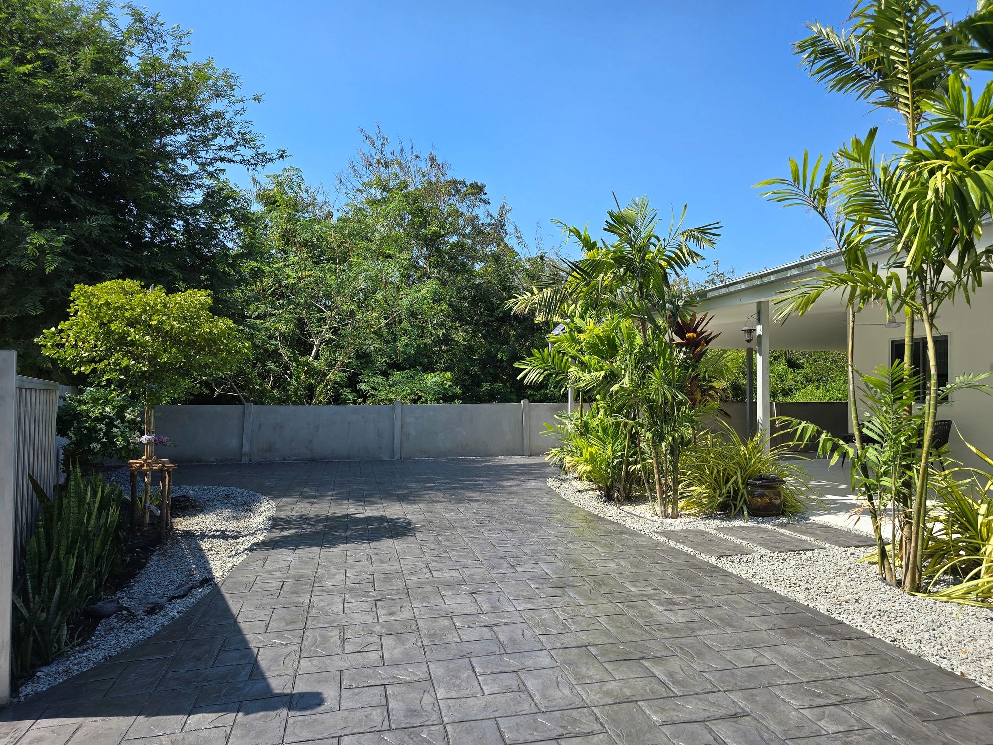 Team members from Concrete and Landscaping working on a residential driveway project